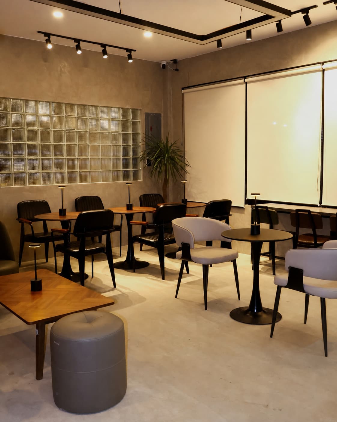 Warm café seating and tables inside More than Mondays